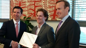 Education Minister Simon Birmingham and Macquarie Telecom managing director government & Hosting Aidan Tudehope presenting the first Macquarie Telecom Western Sydney university Cyber Security Scholarship to Jacob Pace
