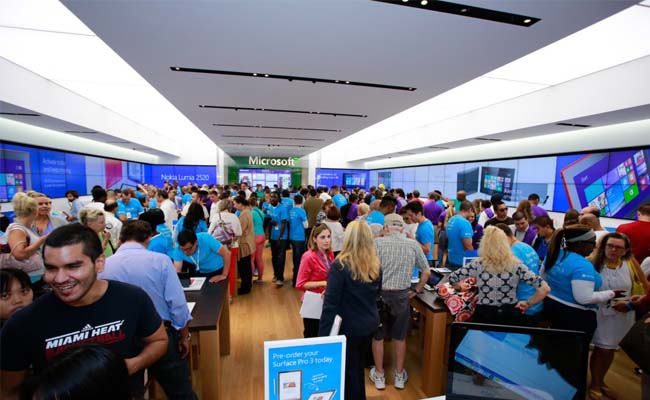 Photo of a busy Microsoft retail store 